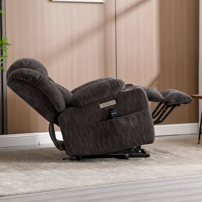 Gray electric height-adjustable recliner with massage function, heating, USB port and cup holder.